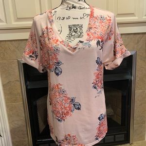 Size medium floral t-shirt. New, never worn.